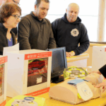 Staff demonstrating proper AED use.