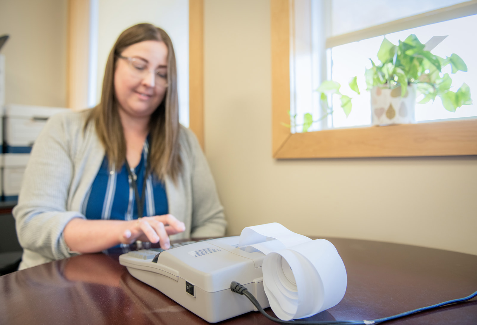 Finance staff types numbers into calculator